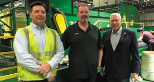 Feature photo: Jeffrey Nella, Jimmy Winters and Will Flower in front of the Winters Bros. recycling machinery at the Town of Brookhaven facility. Jeffrey Nella, Jimmy Winters and Will Flower